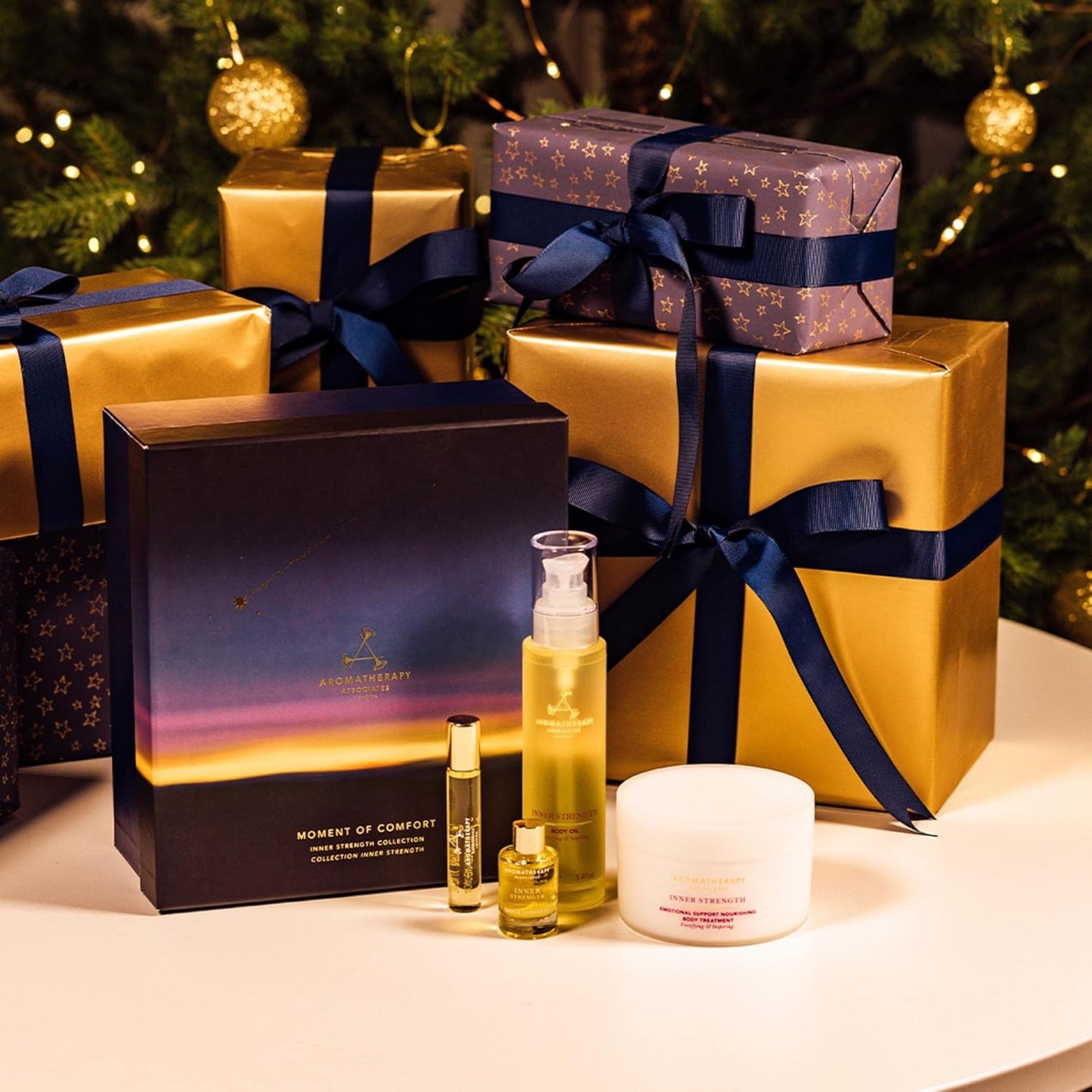 Aromatherapy Associates Moment of Comfort. Luxurious Holiday Gift Set Includes Inner Strength Bath and Shower Oil, Roller Ball, Body Oil, and Body Treatment (1 count)